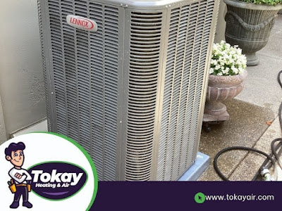 A HVAC unit positioned outside a house